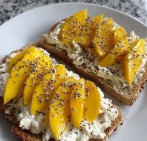 Low-carb toast with cottage cheese, mango, and honey