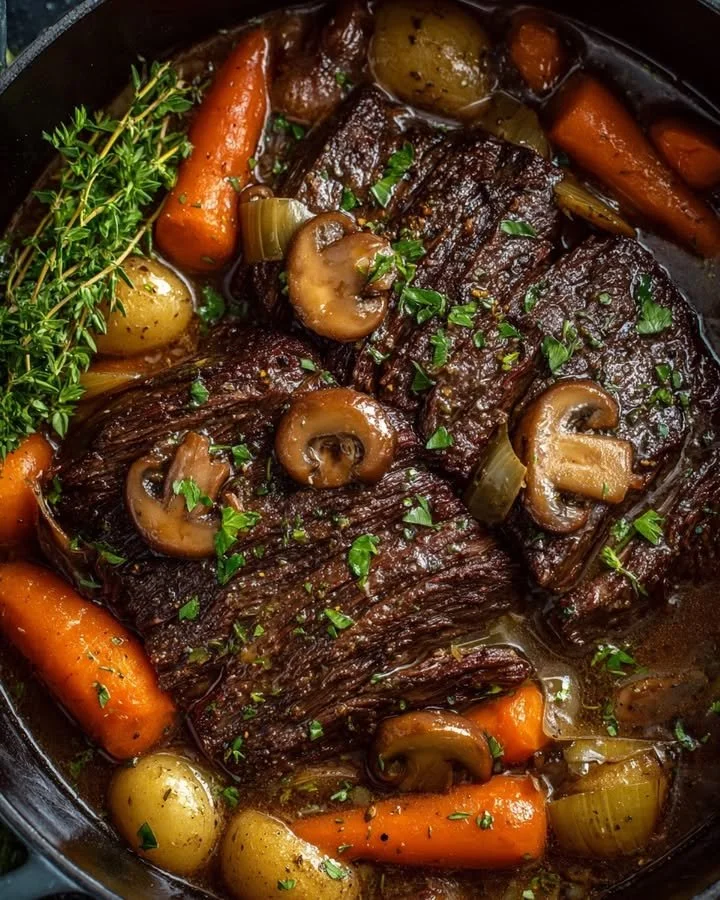 Tender beef roast with colorful vegetables served on a plate
