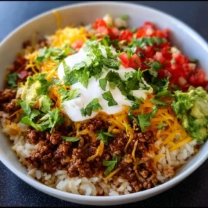 Delicious taco rice bowl with fresh ingredients and toppings