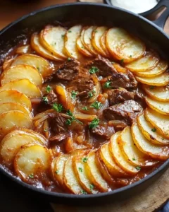 Delicious Beef Stew with Potato Topping in a rustic bowl
