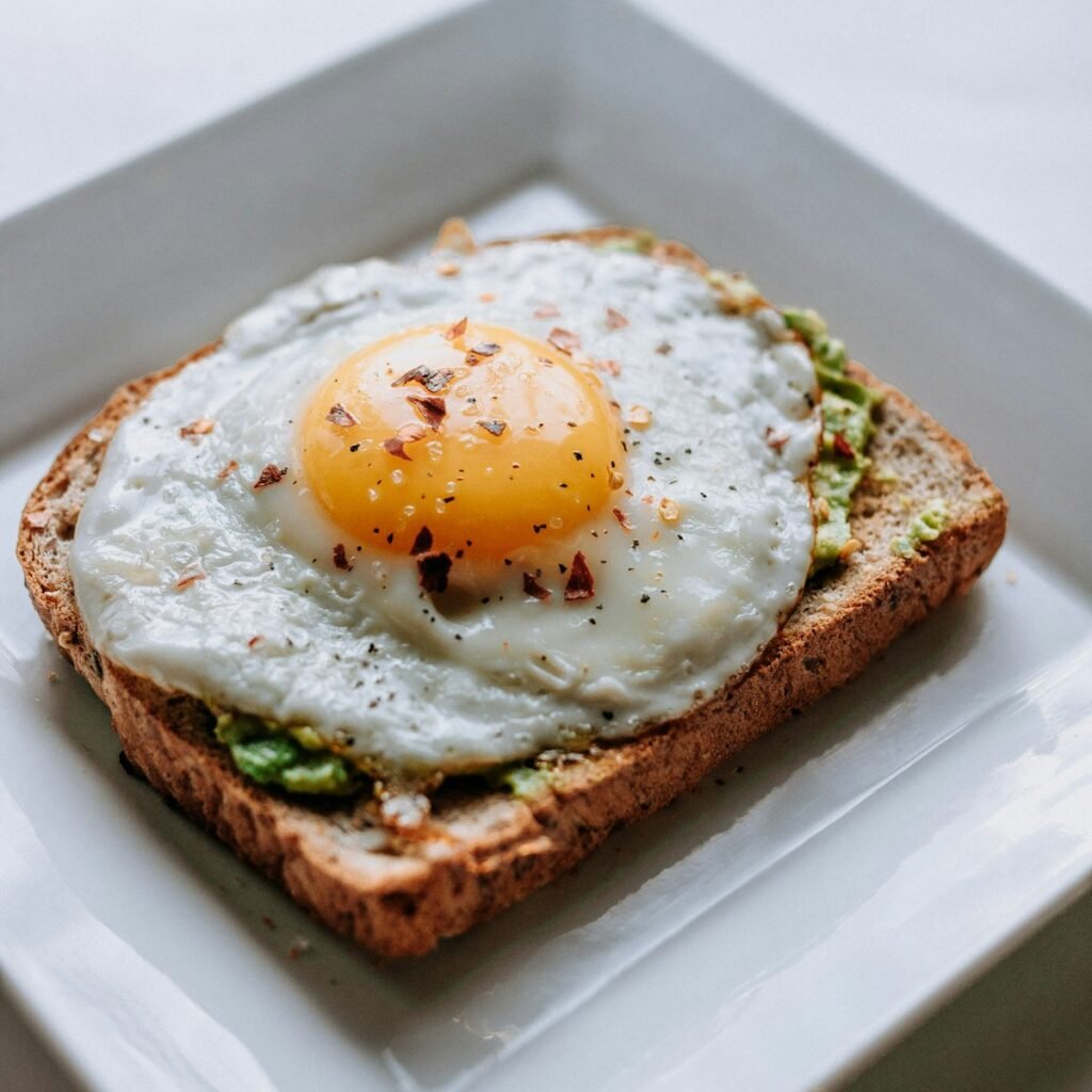 The Best Avocado Toast Recipe (5 Topping Ideas That Actually Work) Avocado toast with poached egg on whole grain bread
