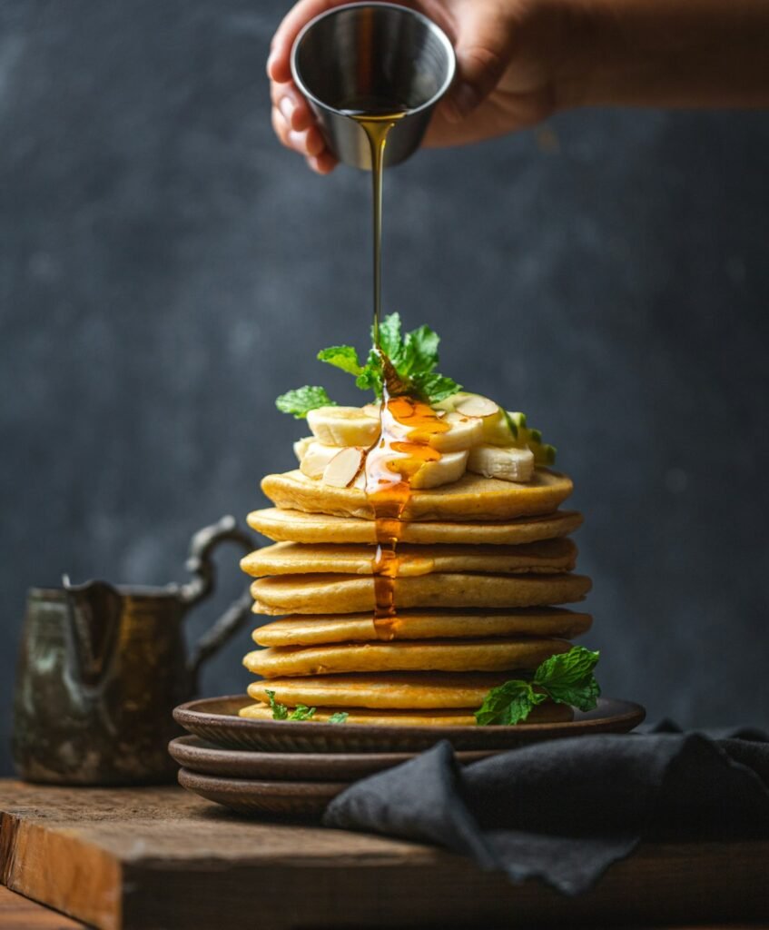 Banana Oat Pancakes Recipe (3 Ingredients, Naturally Gluten-Free) Fluffy banana oat pancakes with maple syrup