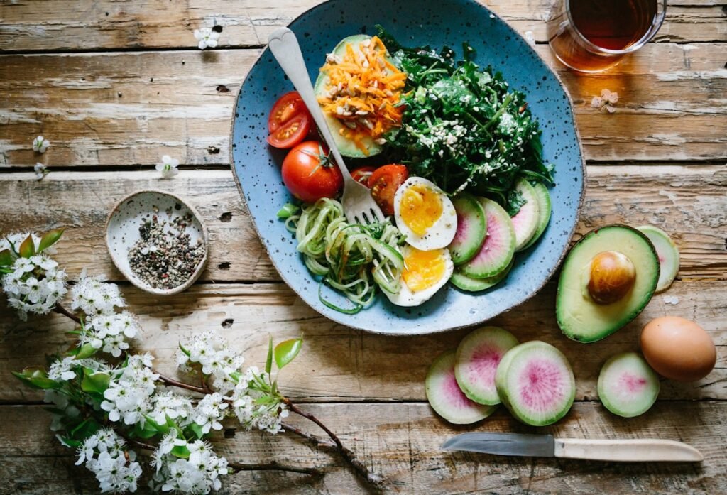 Healthy meal prep containers with colorful vegetables and grains