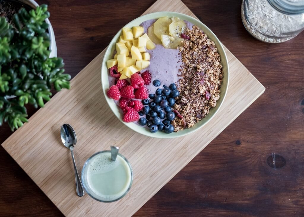 Smoothie Bowl Recipe (How to Make One That's Actually Thick and Filling) Colorful smoothie bowl with fresh fruit toppings